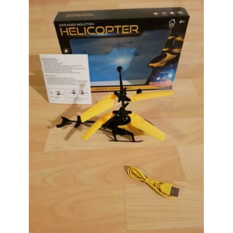 Bestuur de helikopter met je hand.