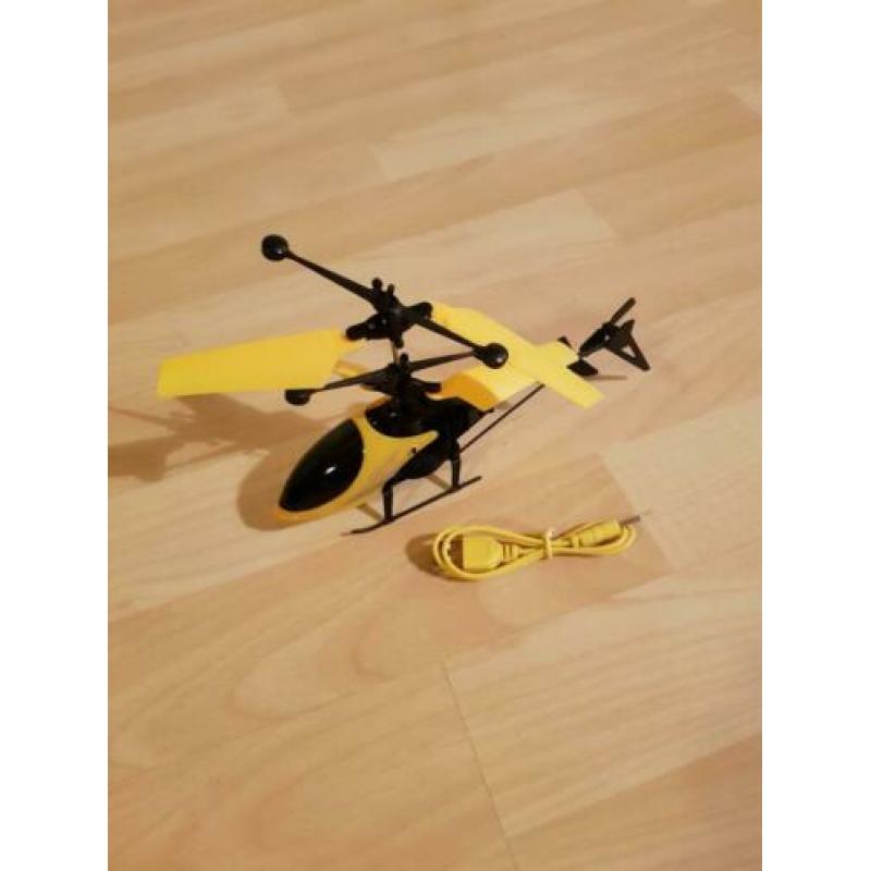 Bestuur de helikopter met je hand.