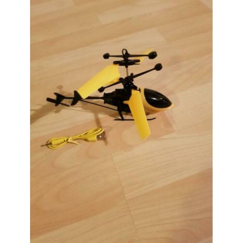 Bestuur de helikopter met je hand.