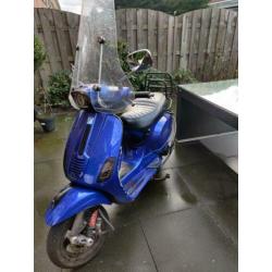 Vespa s custom blauw kenteken 2011
