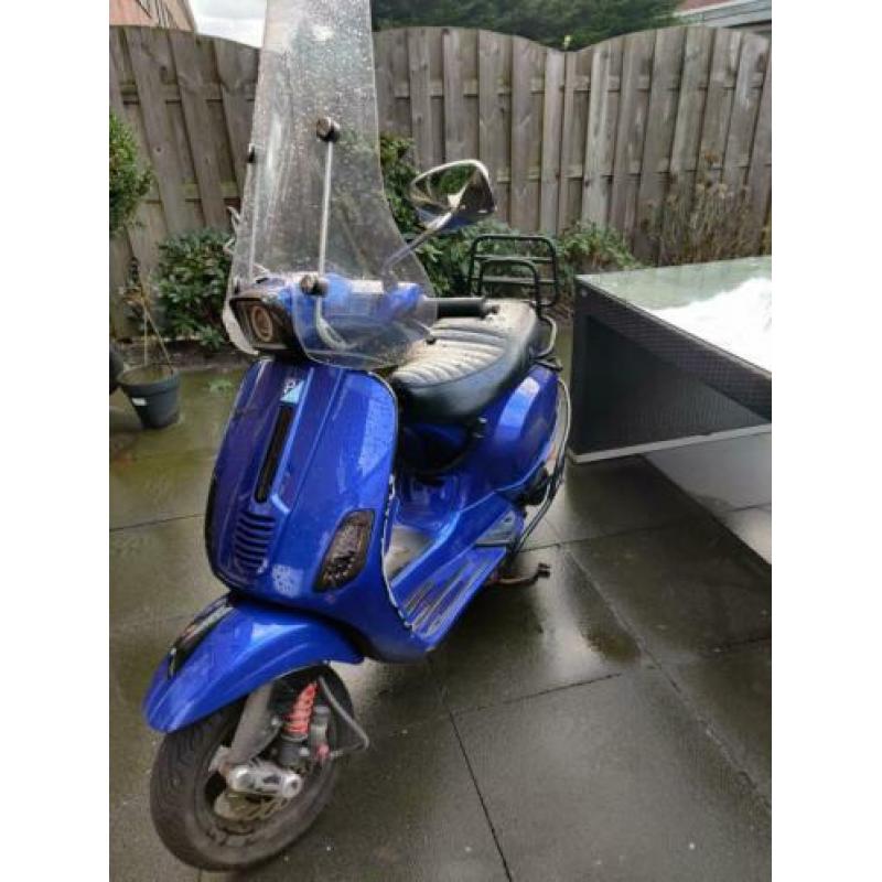 Vespa s custom blauw kenteken 2011