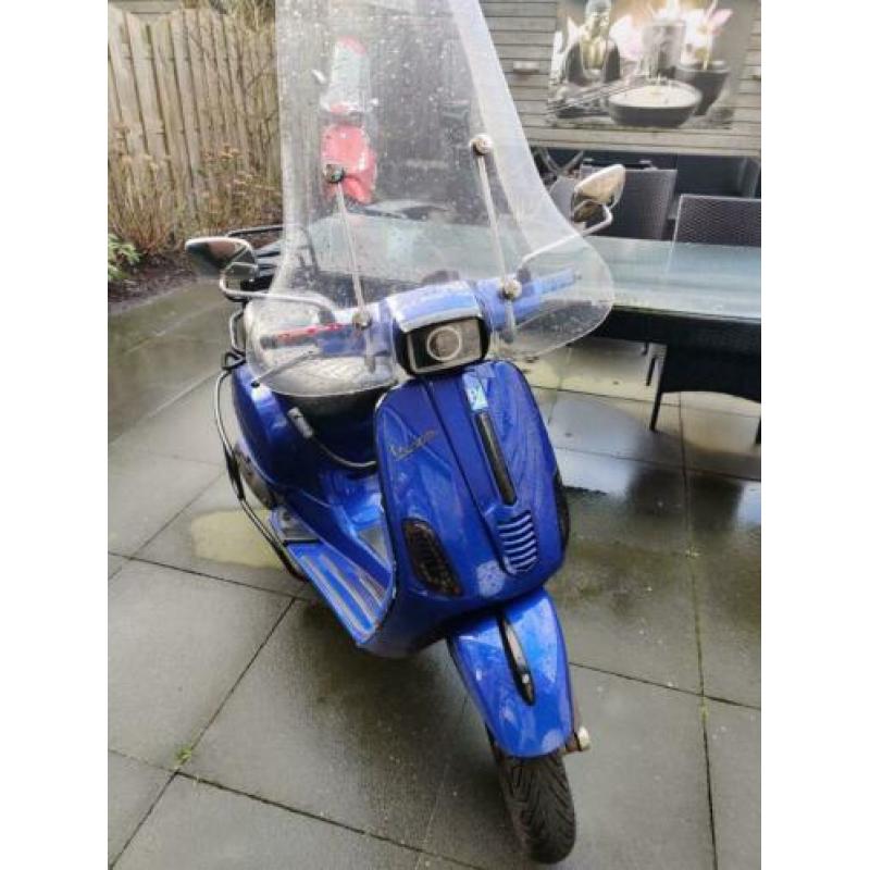 Vespa s custom blauw kenteken 2011